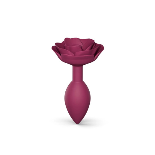 Plug anal en silicone souple avec une butée en forme de rose qui habille l'anus