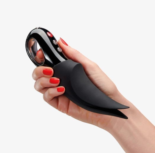 Vibromasseur double fonction, pénétration et stimulation externe, avec sa longueur totale de 18,9cm et son diamètre au plus large de 4,7cm